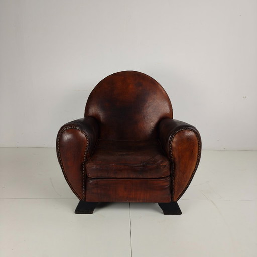 Poltrona da club per gentiluomini in stile Art Déco in pelle