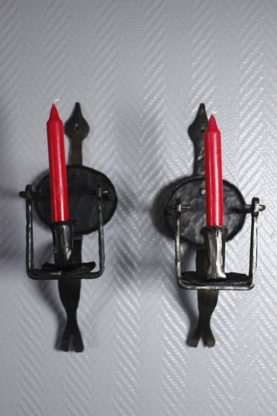 Image 1 of Pair of wrought iron castle-style wall sconces with candles, mid-20th century