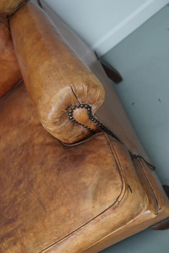 Image 1 of Vintage Nederlandse cognackleurige leren clubfauteuil met voetenbank