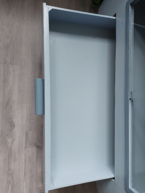 Image 1 of Sideboard with glass sliding doors and rounded shapes