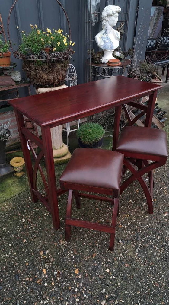 Image 1 of Mahogany wooden breakfast table with 2 chairs with leather upholstery dim. 107x47cm and 92cm high.