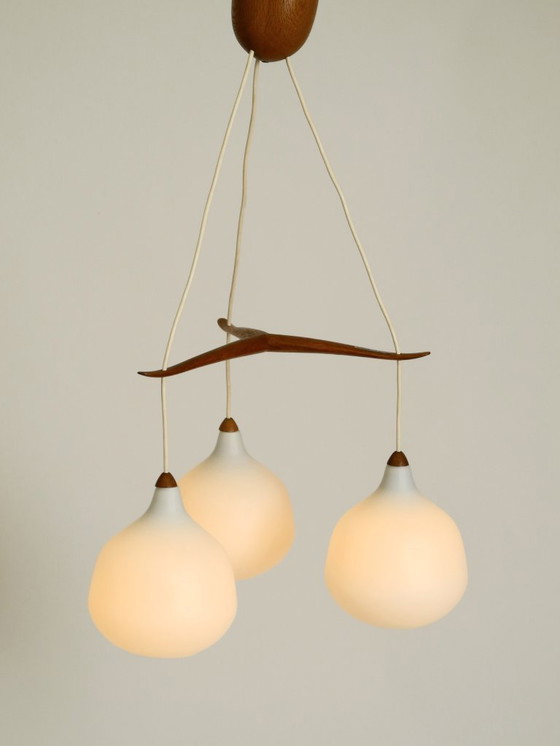 Image 1 of Beautiful pendant lamp with three opal glass shades and a teak frame by Uno & Östen Kristiansson for Luxus Vittsjö, Sweden 1957