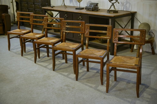 Set van 6 eikenhouten stoelen in de stijl van Pierre Cruège, jaren 1940.