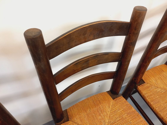 Image 1 of Set van 4 vintage brutalistische stoelen van Georges Robert, gemaakt van hout en stro, uit de jaren 50 en 60.