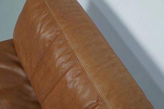 Image 1 of De Sede DS 76 loungestoel / slaapbank van cognackleurig leer, Zwitserland, jaren 1970