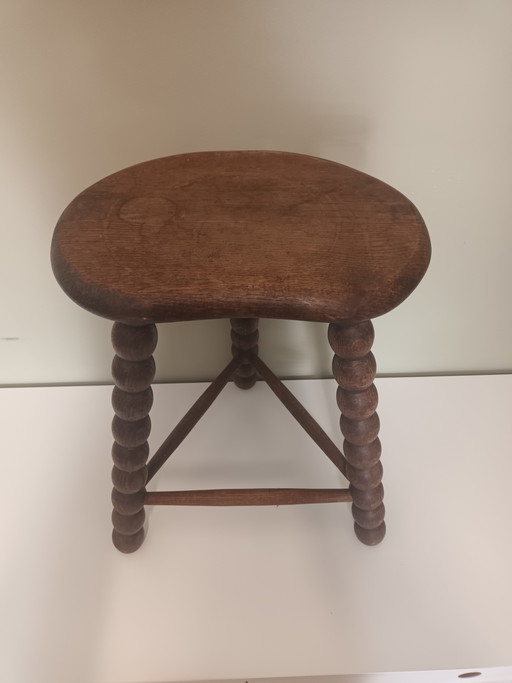 Wooden stool with turned legs