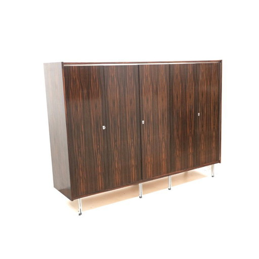 Large vintage designer closet with hanging and laying section from the 1960s