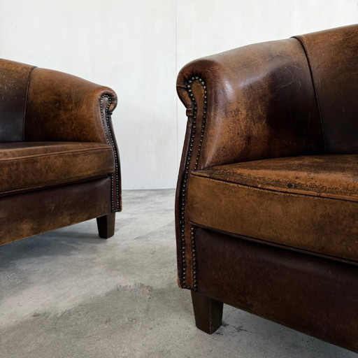 2 Fauteuils en peau de mouton de style Art Déco