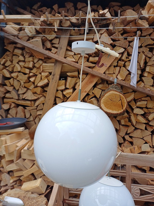 Three milky white glass lamps round