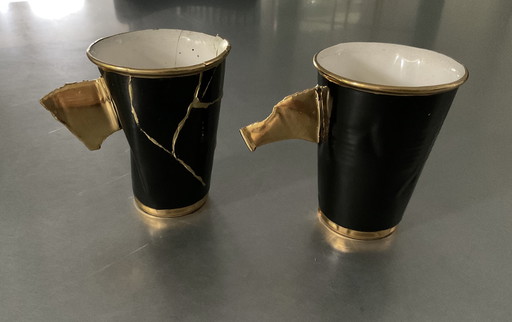 2x seltene "Faltenbecher" schwarz und gold
