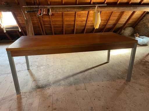 Simple modern, sleek oak table with stainless steel legs