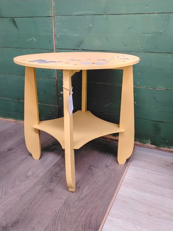Image 1 of Round table with butterflies