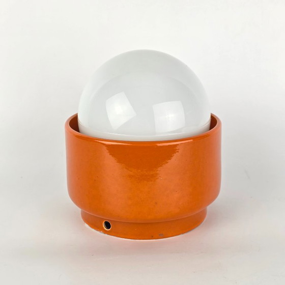 Image 1 of Vintage German ceramic lamp with a glass globe shade. Can be used as a wall lamp, table lamp, or sconce. Orange. 70s / retro