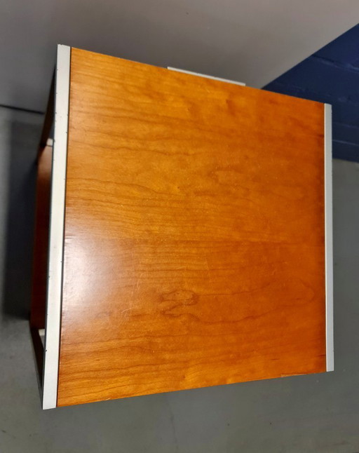 Mid-century vintage bedside table made of wood and metal in the style of George Nelson