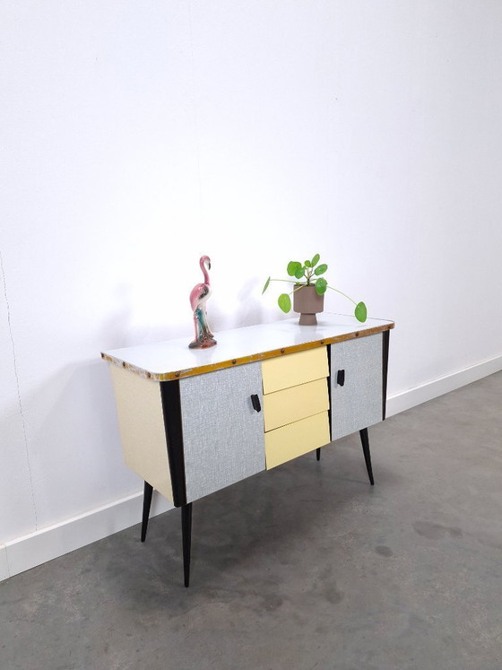 Image 1 of 1950s light blue-yellow cabinet with Formica and slanted legs