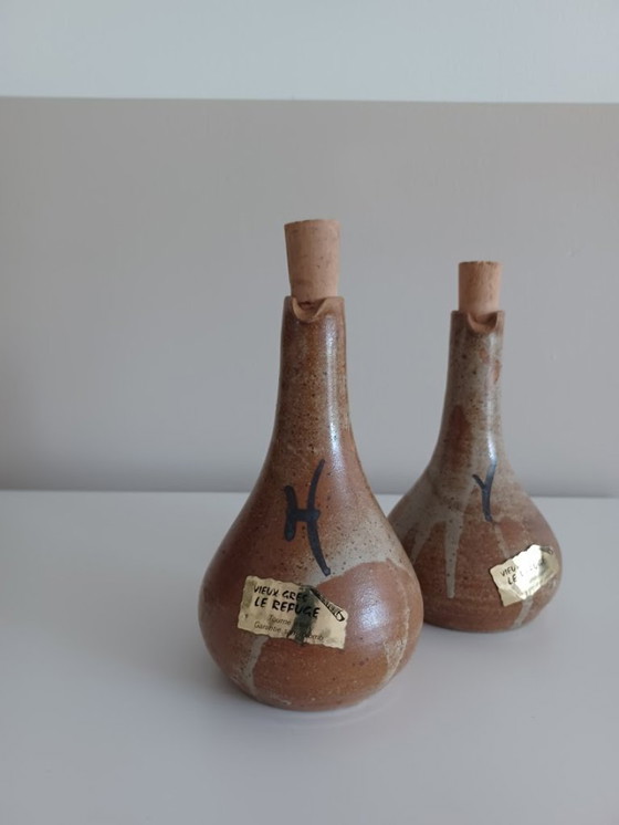 Image 1 of Set di due vasi da olio e aceto vintage, fatti a mano. In ceramica. Metà secolo.