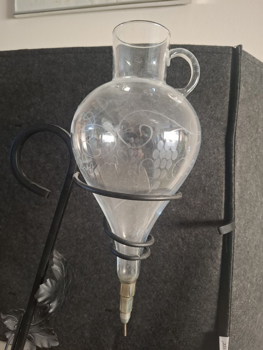 Antique wine pourer / carafe with metal stand