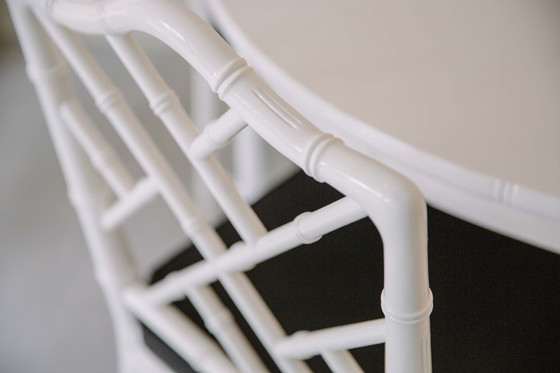 Image 1 of Dining room table and 4 chairs Jonathan Adler style. In 2024 the seats of the chairs are upholstered in black fabric.