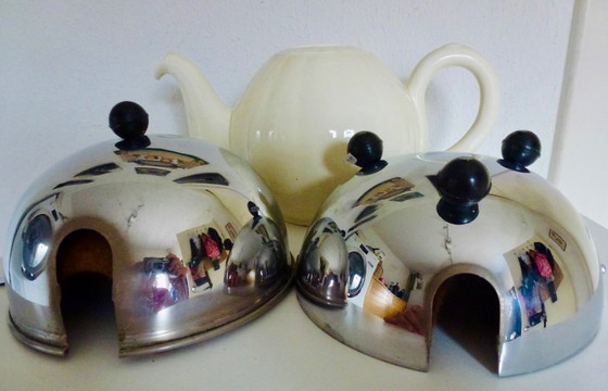 Image 1 of Ceramic Teapot with thermal Chrome casing which keeps the contents hot (or cold).