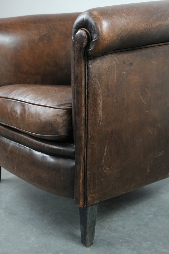 Image 1 of Sturdy and characterful vintage sheepskin club armchair