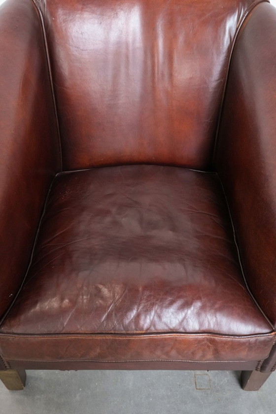 Image 1 of Vintage clubfauteuil gemaakt van schapenleer met siernagels