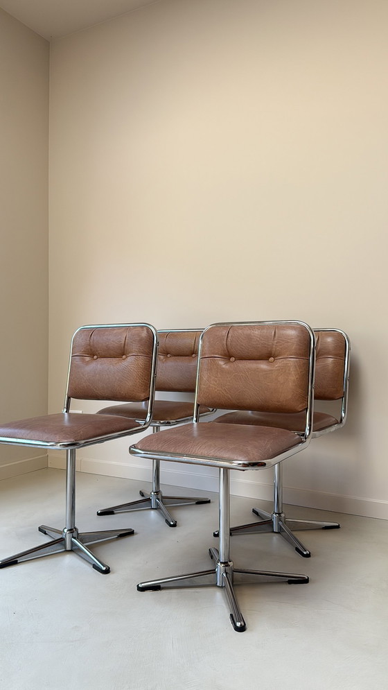 Image 1 of Four vintage chrome swivel chairs with faux leather