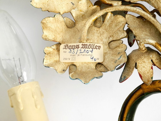 Image 1 of Une paire de magnifiques appliques murales en métal doré et peint à la main, datant des années 1960, signées Hans Möller.