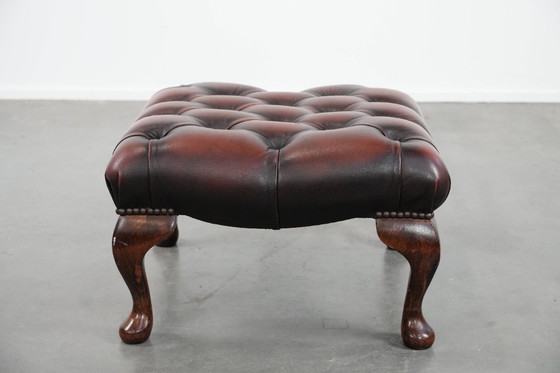 Image 1 of Dark brown Chesterfield footstool made of cowhide