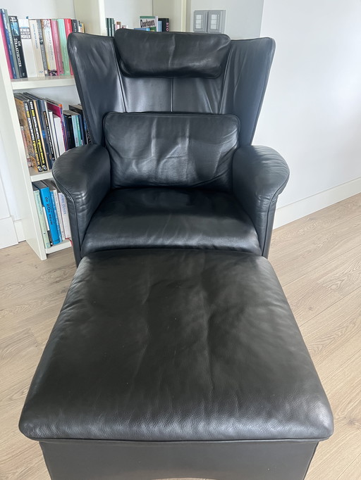 DeSede DS23 black leather designer ear armchair with footstool.