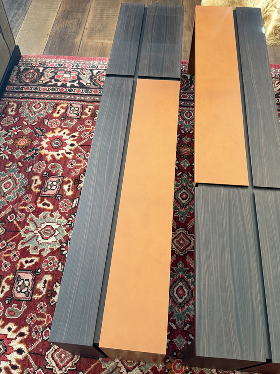 Image 1 of Custom-made, asymmetrical coffee tables (twin) of Macassar wood with orange calfskin details.