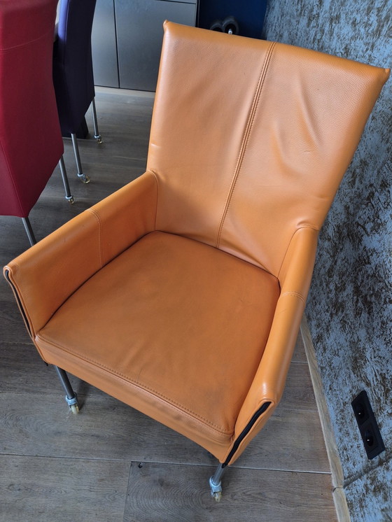 Image 1 of 8 chaises de salle à manger en cuir Vitron – 4 coloris – pieds en acier inoxydable avec roulettes