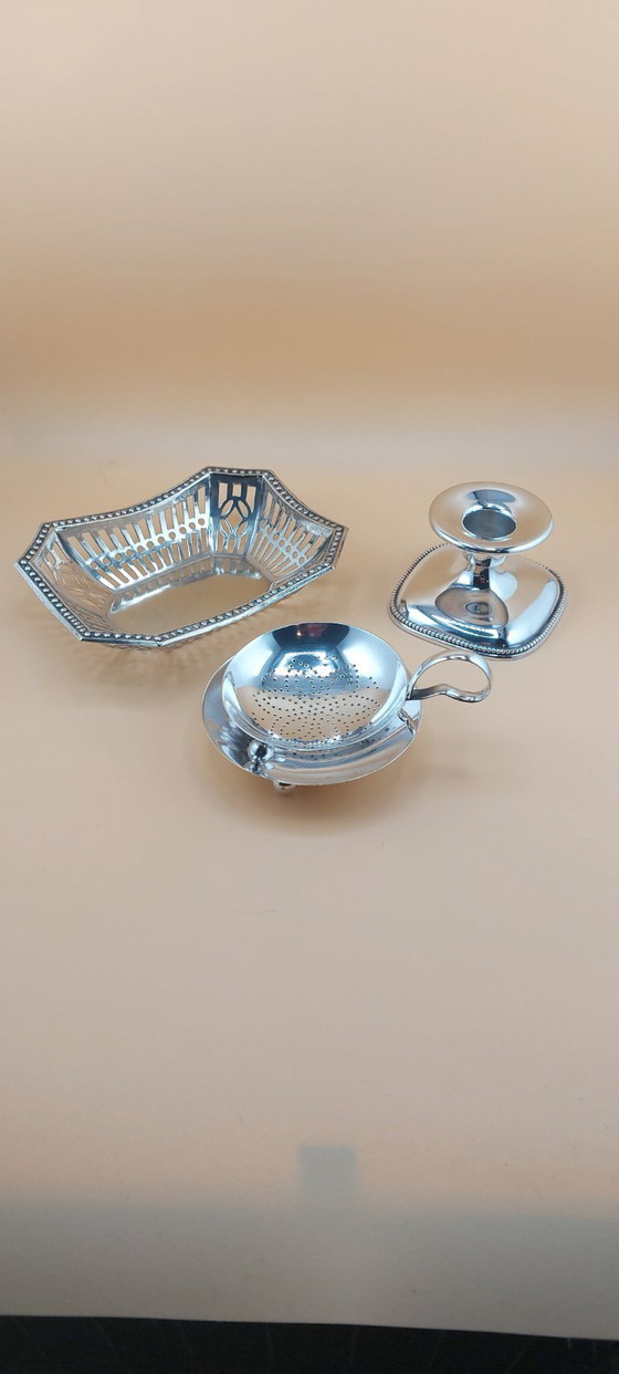 Image 1 of Lot of silver-plated items including candlestick, small bowl, tea strainer
