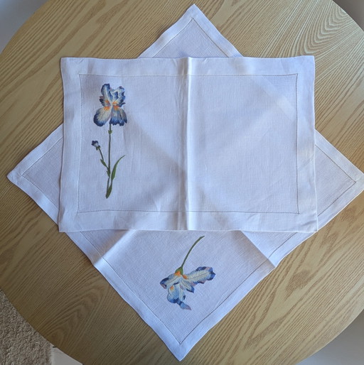 Set and matching napkin with Iris motif attributed to D. Porthault