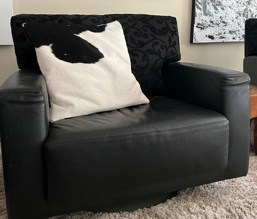 Poltrona girevole in morbida pelle Montis