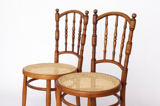 Image 1 of Set van 4 Josef Kohn gebogen houten stoelen – Oostenrijkse vintage jaren 30-50, beukenhout met Weense rieten zittingen, Thonet-s