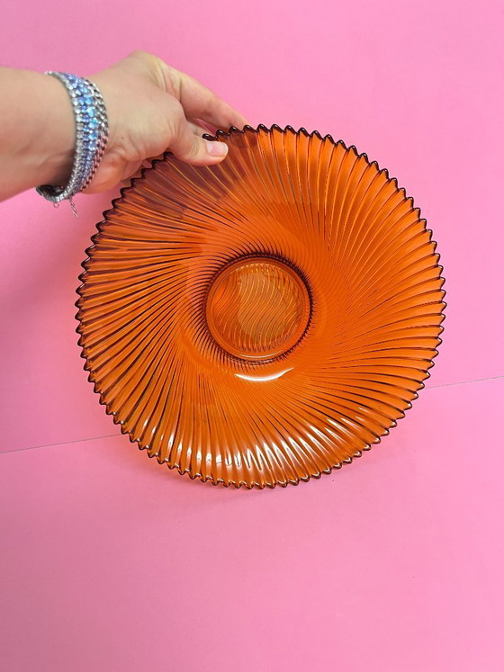 Image 1 of Vintage 70s swirl amber glass amber sunburst fruit bowl sawtooth edge orange