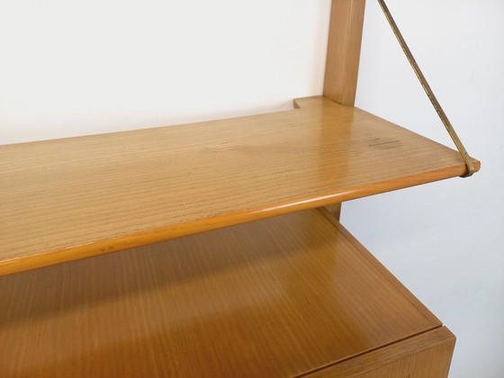 Image 1 of Wall-mounted bookcase with vintage light wood and brass secretary bar, dating from the 1960s