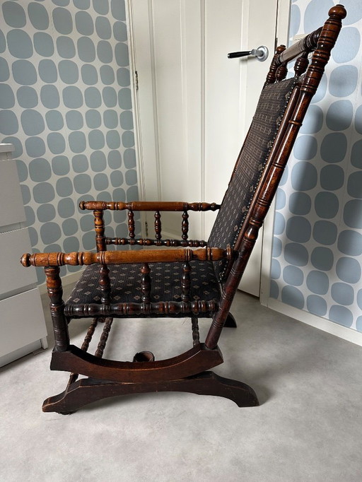 1 antique walnut rocking chair reupholstered about 10 years ago.