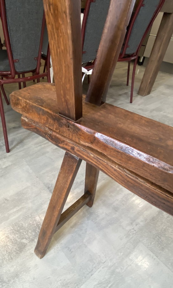 Image 1 of Twee massief eikenhouten boerenbanken van 214 cm voor een rustieke boerentafel uit de jaren 50.