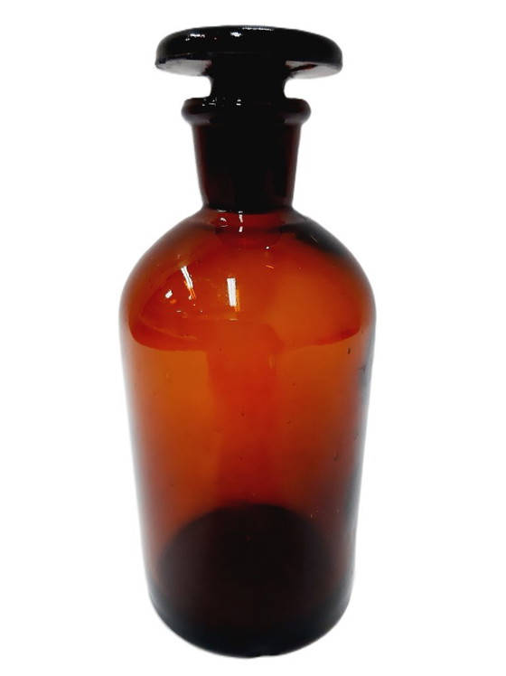 Image 1 of Vintage amberkleurige glazen apothekersfles met grondstop