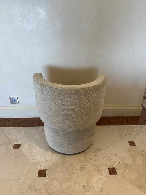 Small round upholstered armchair 