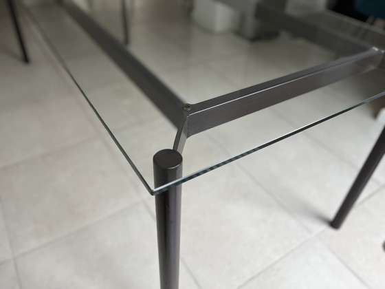 Image 1 of Mesa de comedor de cristal de diseño único con base de acero 218x87 cm