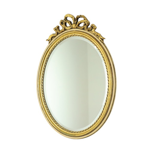 Miroir ovale doré à la feuille d'or