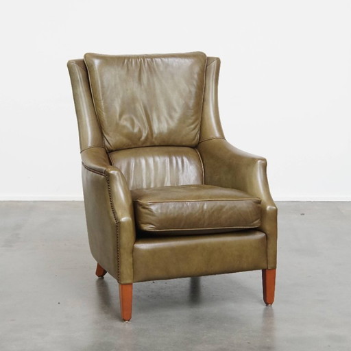 Fauteuil en cuir de vachette vert olive avec rivets décoratifs