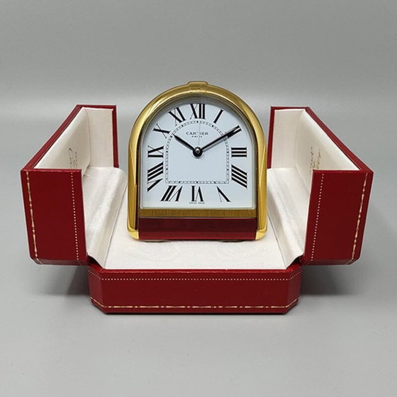 Image 1 of Cartier "Romane" reis- en bureauwekker uit de jaren 80, verguld met 18 karaats goud, inclusief originele doos en papieren.