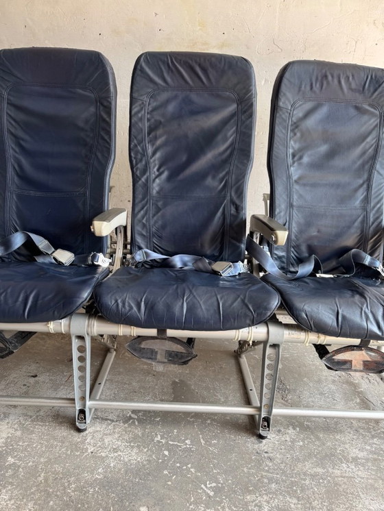 Image 1 of Vintage driepersoons vliegtuigstoelen - Recaro