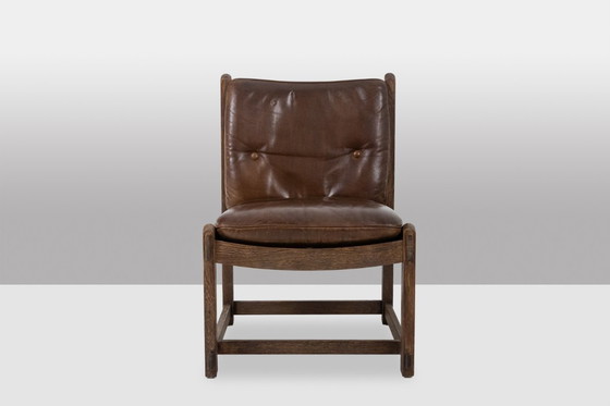 Image 1 of Paar eikenhouten loungestoelen, bekleed met leer. Gemaakt in de jaren 60.