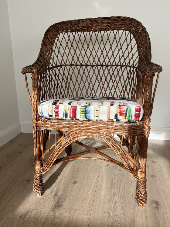 Image 1 of Pierre Frey geflochtener Sessel mit Kissen