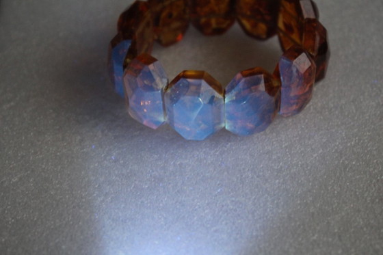 Image 1 of Amber bracelet, intricately cut, 46 grams of honey amber.