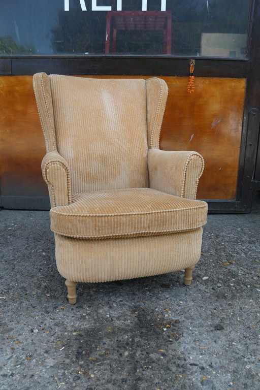 A comfortable ear chair. Fully restored with a Camel Rib.